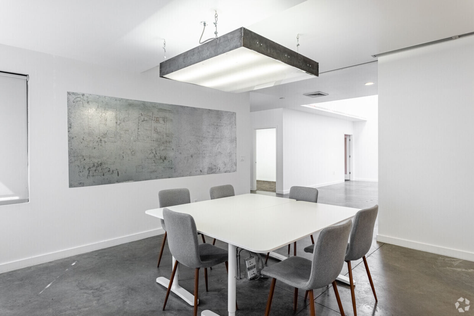 Window-lined conference room for lease at 1815 Slabtown office Portland with multimedia setup