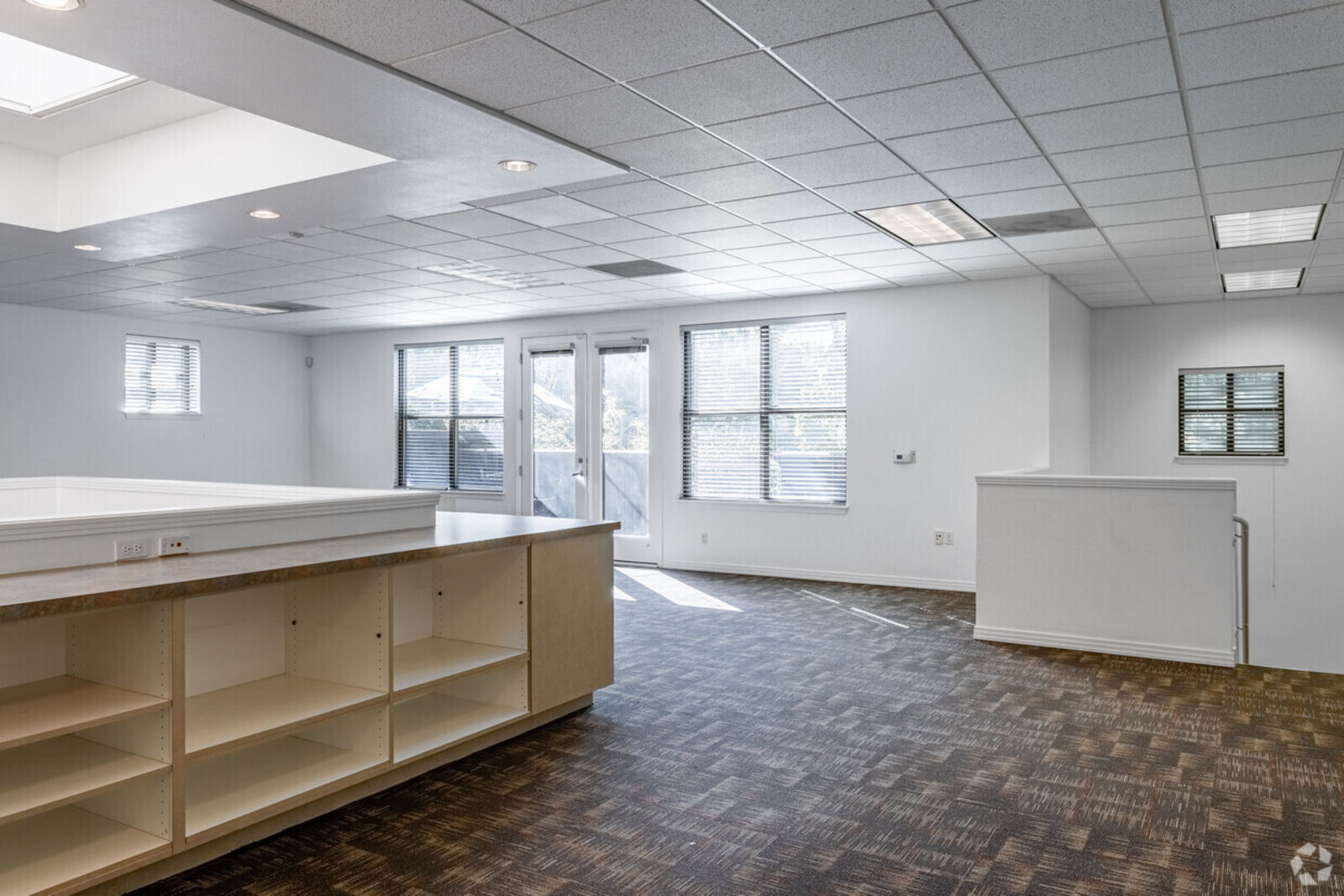 Open creative workspace for lease at 1815 NW Overton St in Slabtown Portland with large windows and built-in counter